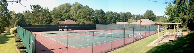 Two Hard-Surface Tennis Courts In Community