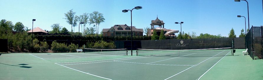 Tennis Courts And Water-Slide Tower In Background