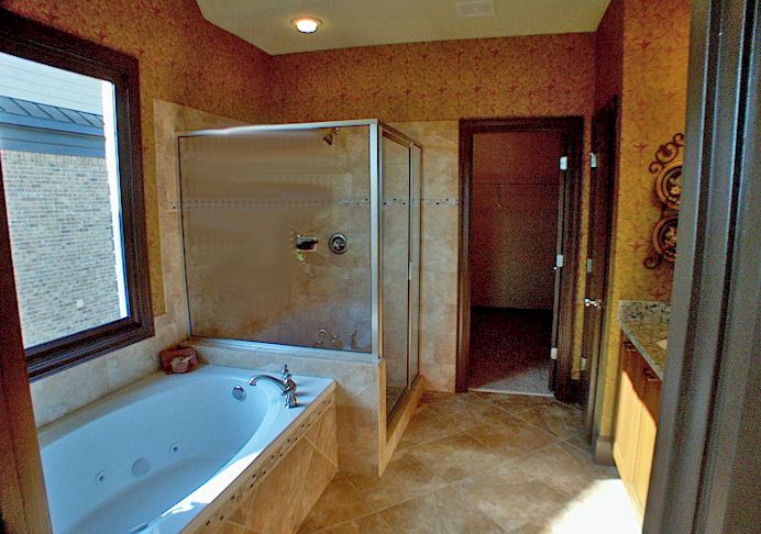 Jetted Garden Tub, Separate Shower, Artisan Tiles, Dual Italian Vanities And Granite Counters.